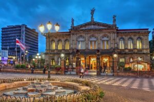 Night scene of the square in front of the National Theatre of Costa Rica in San Jose at twilight time.
