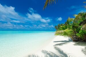 tropical Maldives island with white sandy beach and sea